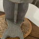 Small footrest bench in solid wood with a slate grey patina.