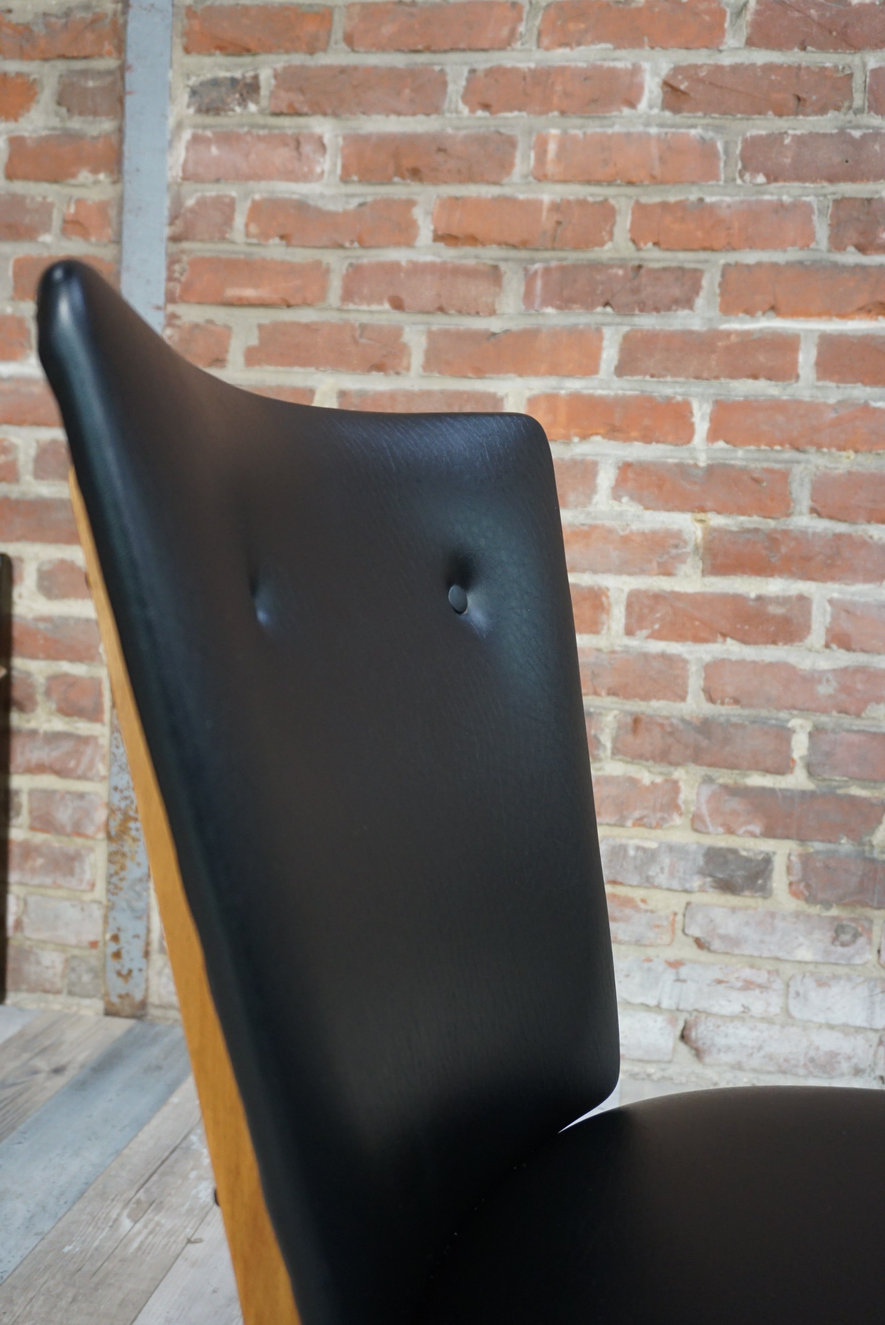 Chair 50 years in wood and faux black leather cocktail