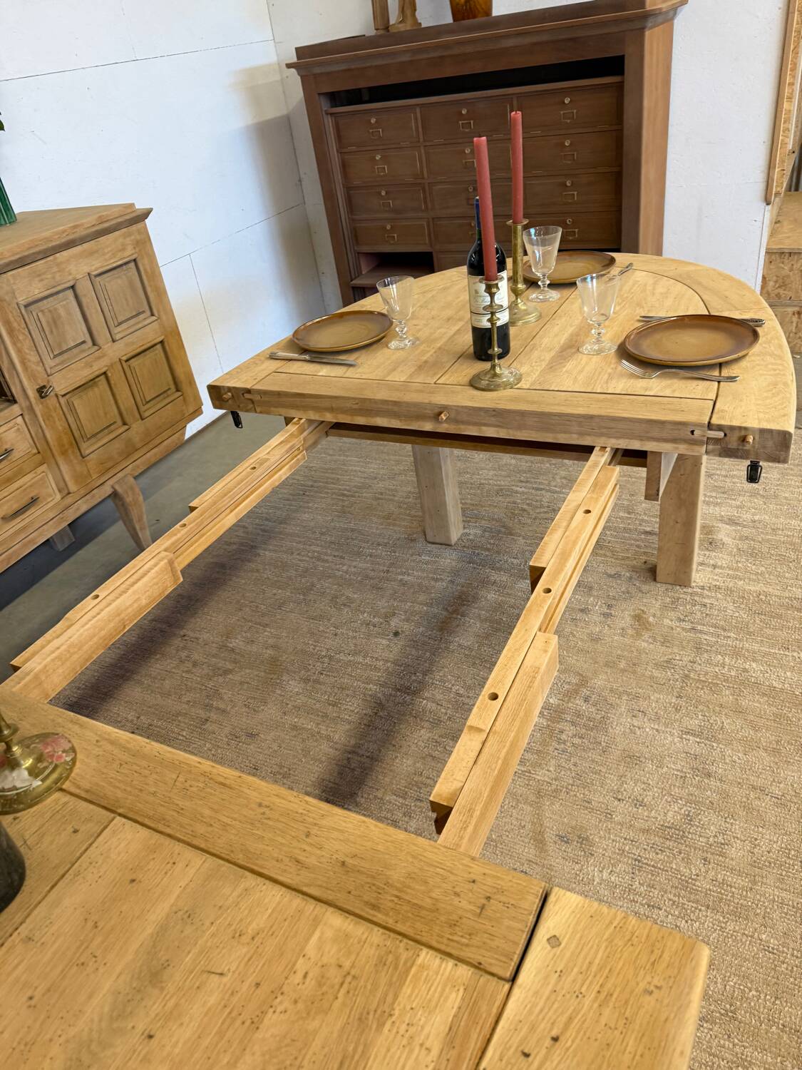 Oval farmhouse table in solid oak with extensions.