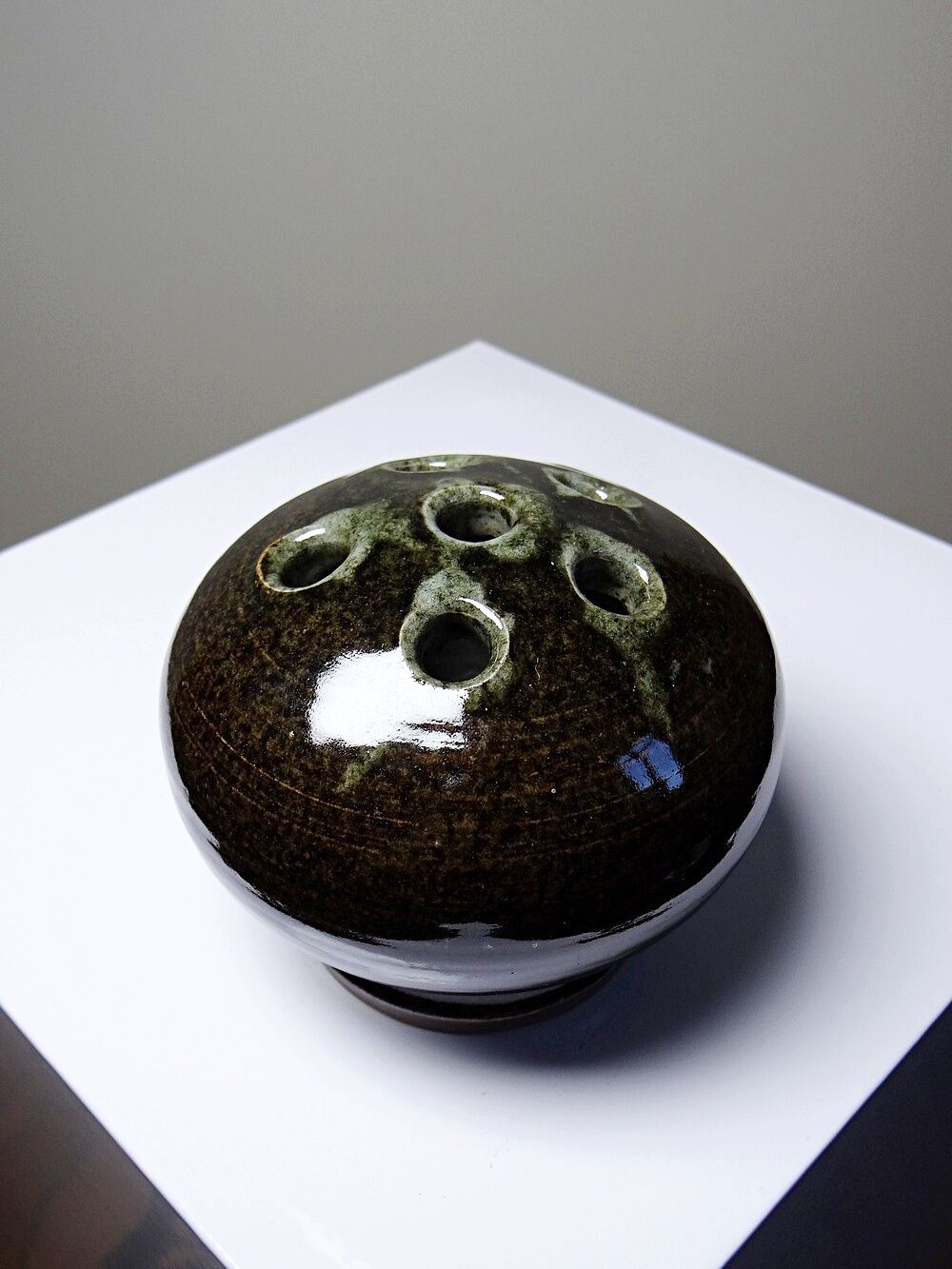 Brown and green glazed stoneware flower holder, vintage craftsmanship from the 1970s-1980s.