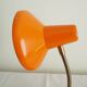 Orange colored metal desk lamp from the 1960s-1970s