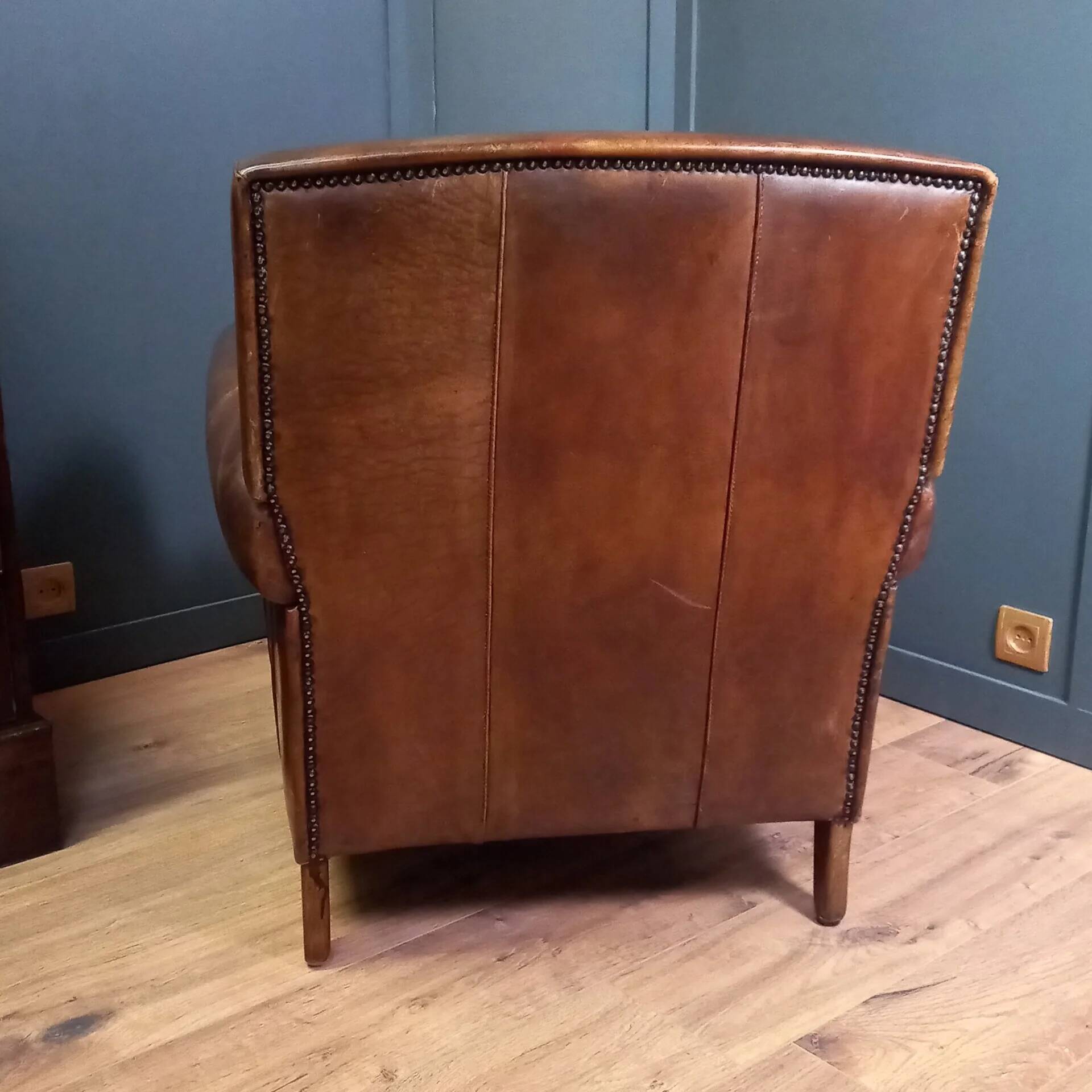 Club armchair in sheepskin in Art Deco style