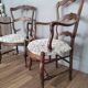 Pair of Provençal armchairs in brown wood and floral fabric.