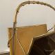 Magazine rack in bronze from the 50/60s