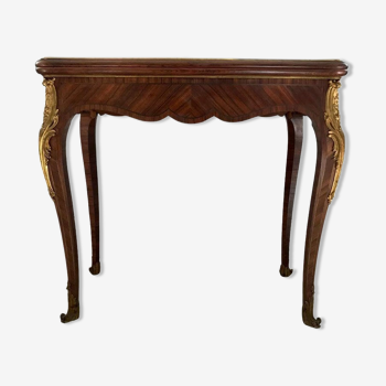 Console transforming into a 19th century Louis XV style gaming table