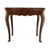 Console transforming into a 19th century Louis XV style gaming table
