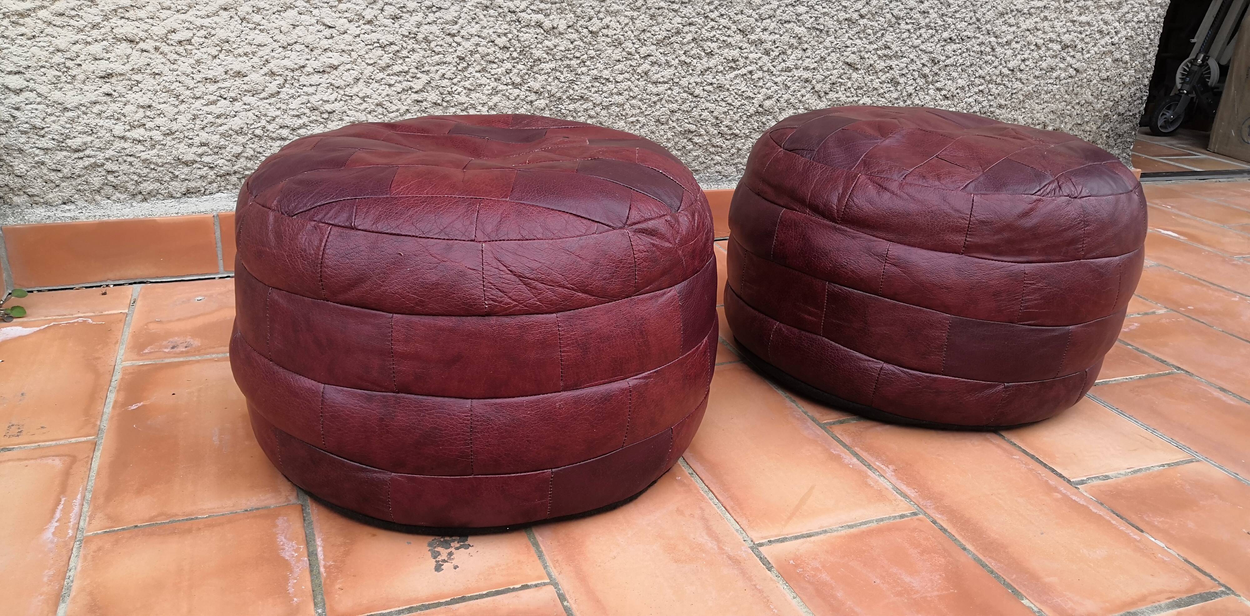 Pair of vintage poufs in burgundy leather patchwork, 1970
