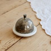 Small butter dish with a vintage cloche in white porcelain and patinated silver-plated metal.
