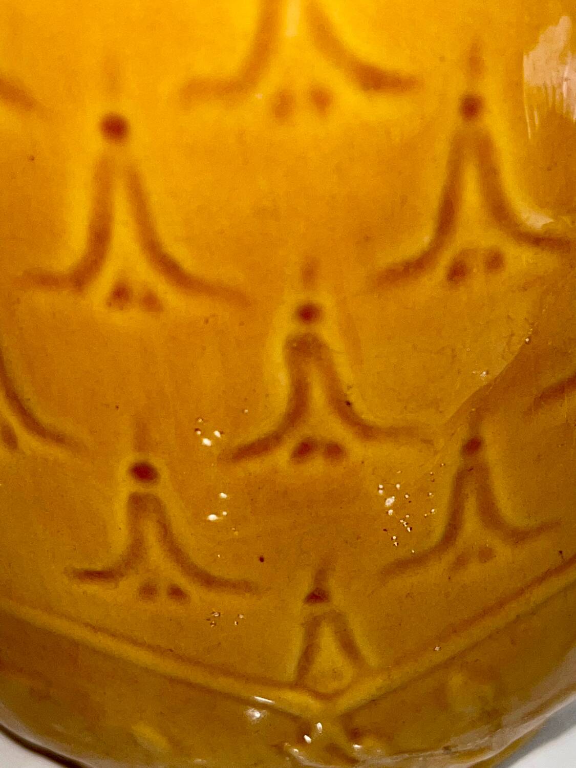 Antique pitcher with flower decoration