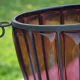 Large blown glass and wrought iron vase on shower stand