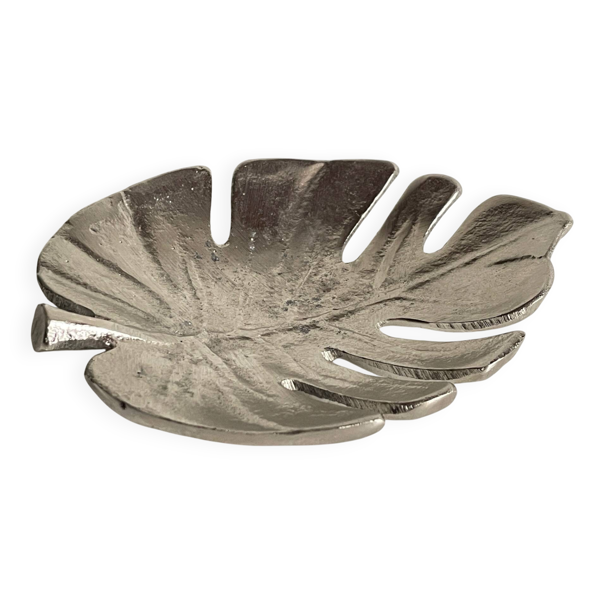 Leaf-shaped metal pocket emptier
