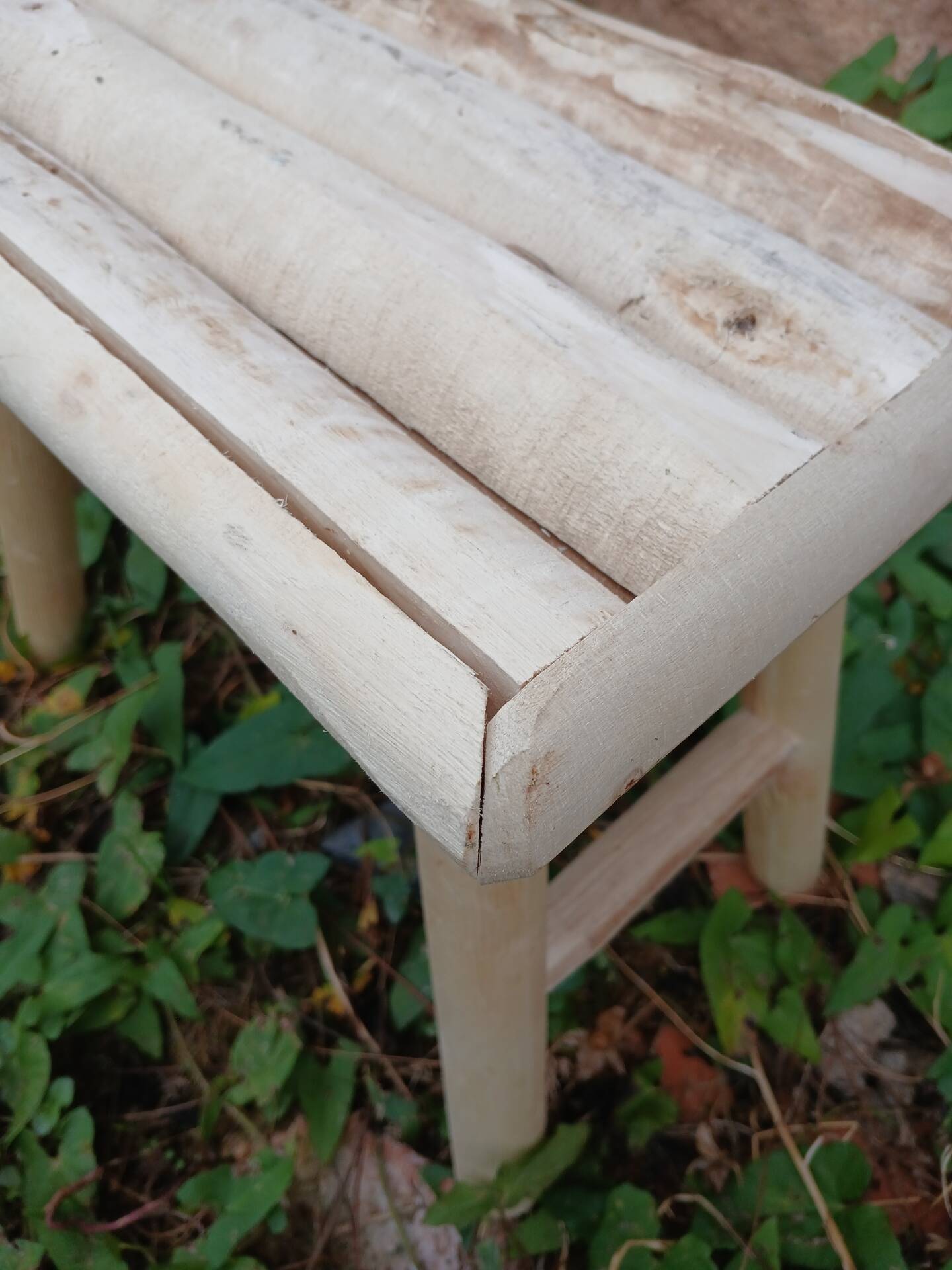 Small stool in raw wood