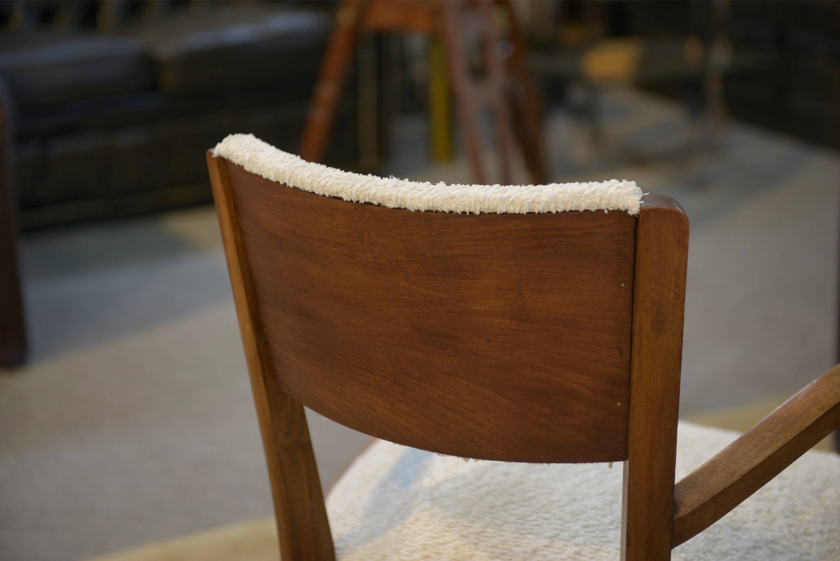 Pair of bridge armchairs in walnut and cream boucle fabric, early 20th century.