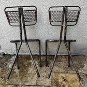 Pairs of perforated metal chairs by René Malaval