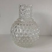Beautiful and large vintage glass jug with a handle, made of clear hot-worked glass.
