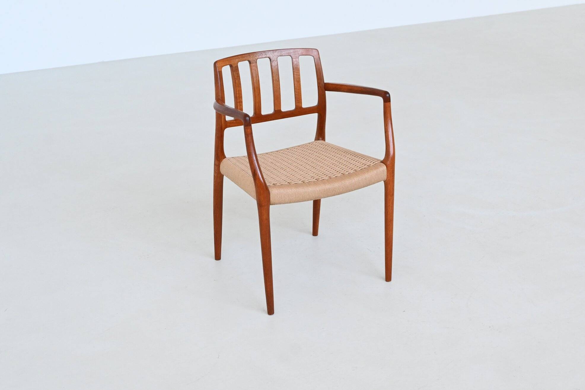 Niels Otto Moller model 66 armchairs teak and paper cord Denmark 1974