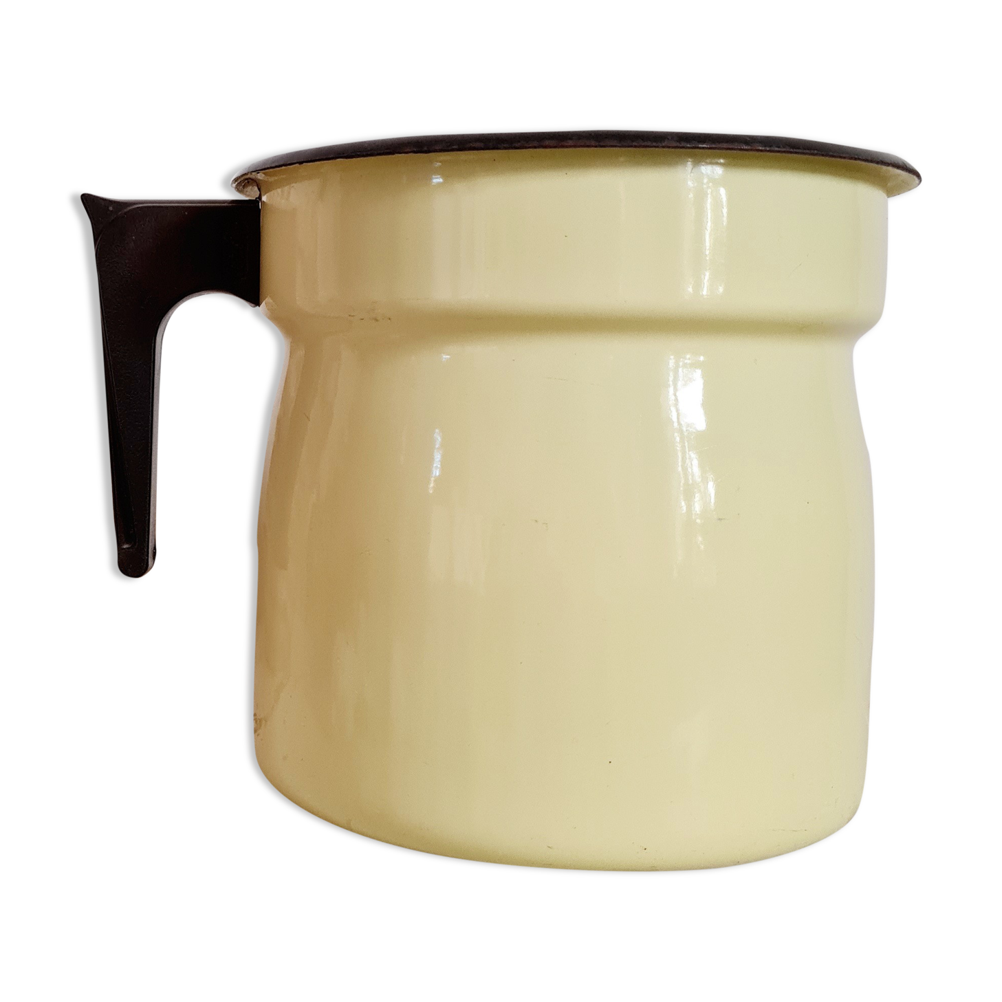 Old pitcher in yellow enamelled sheet metal