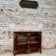 Low showcase in rosewood veneer of the regency xviii th century