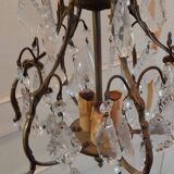 Small bronze "cage" chandelier with three lights decorated with tassels and pendant. Late 19th century