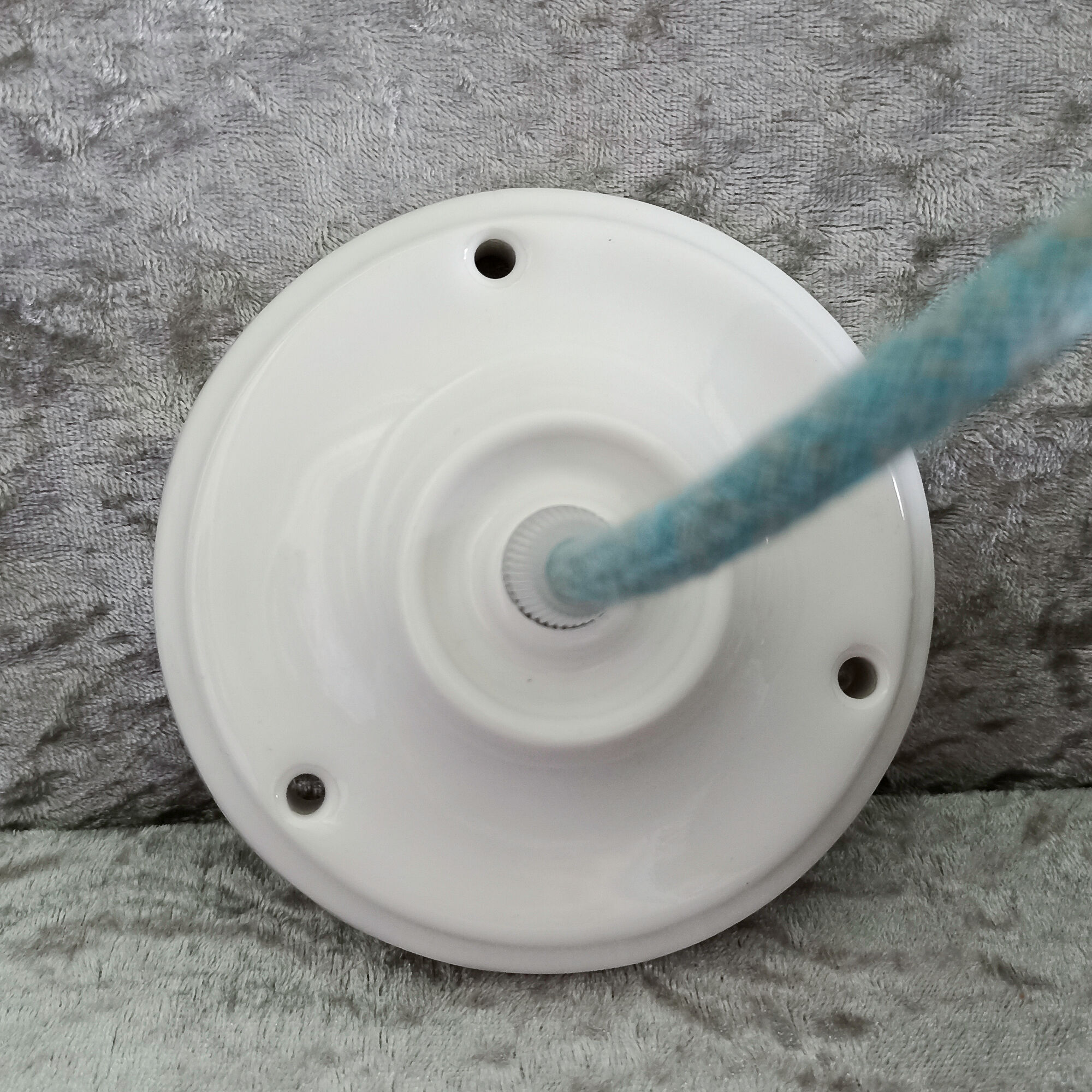 Old enamelled sheet metal suspension with glass cup