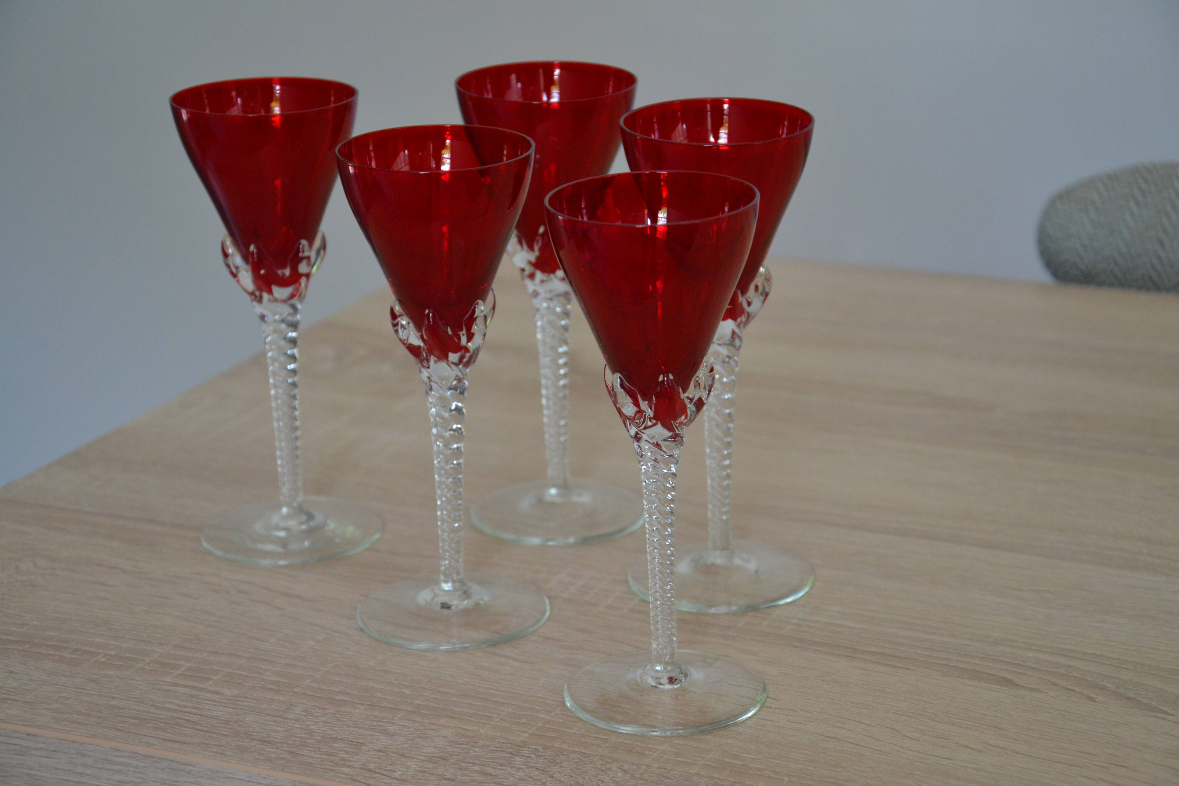 5 red crystal glasses with twisted stems