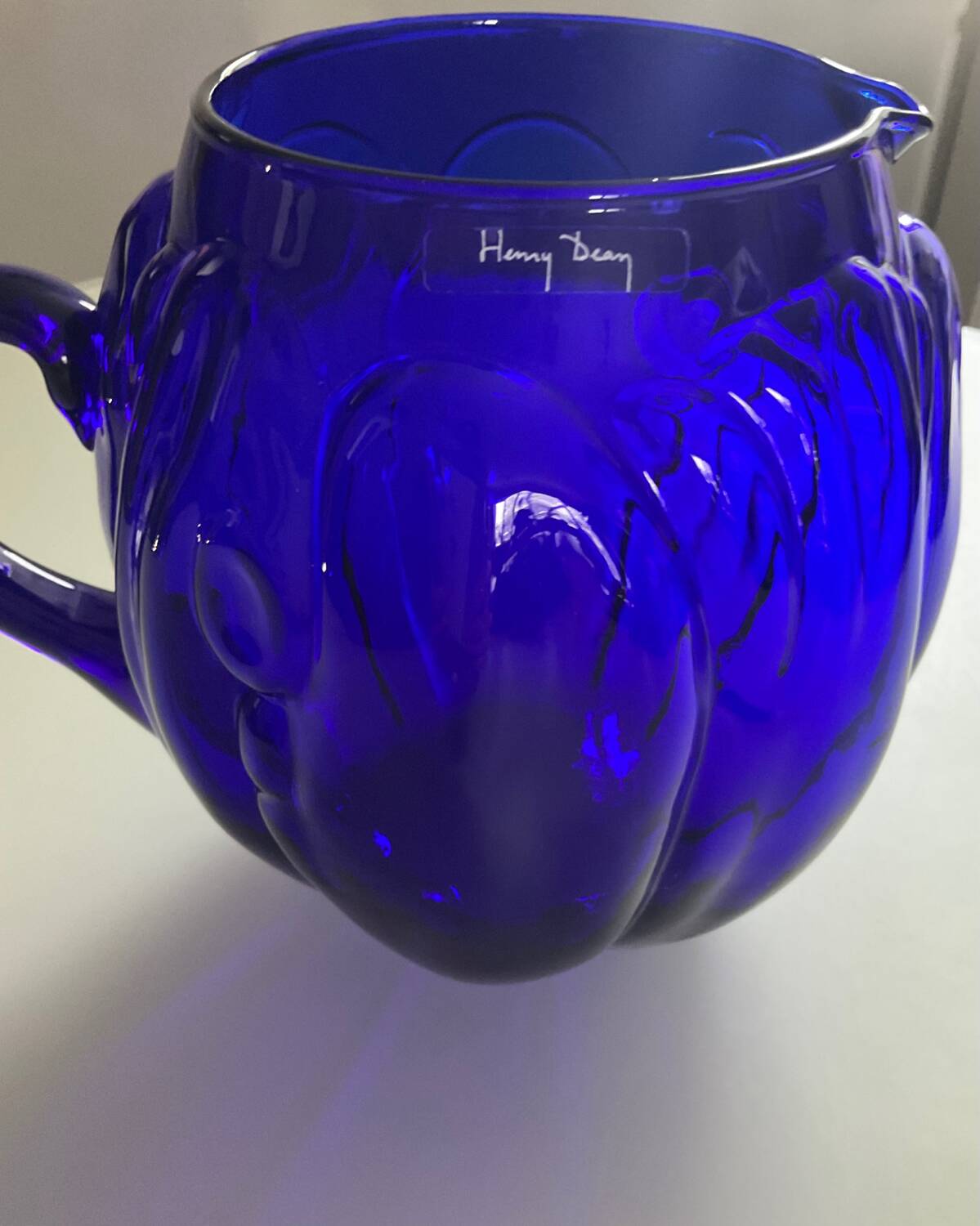 Vintage cobalt blue glass pitcher by Henry Dean