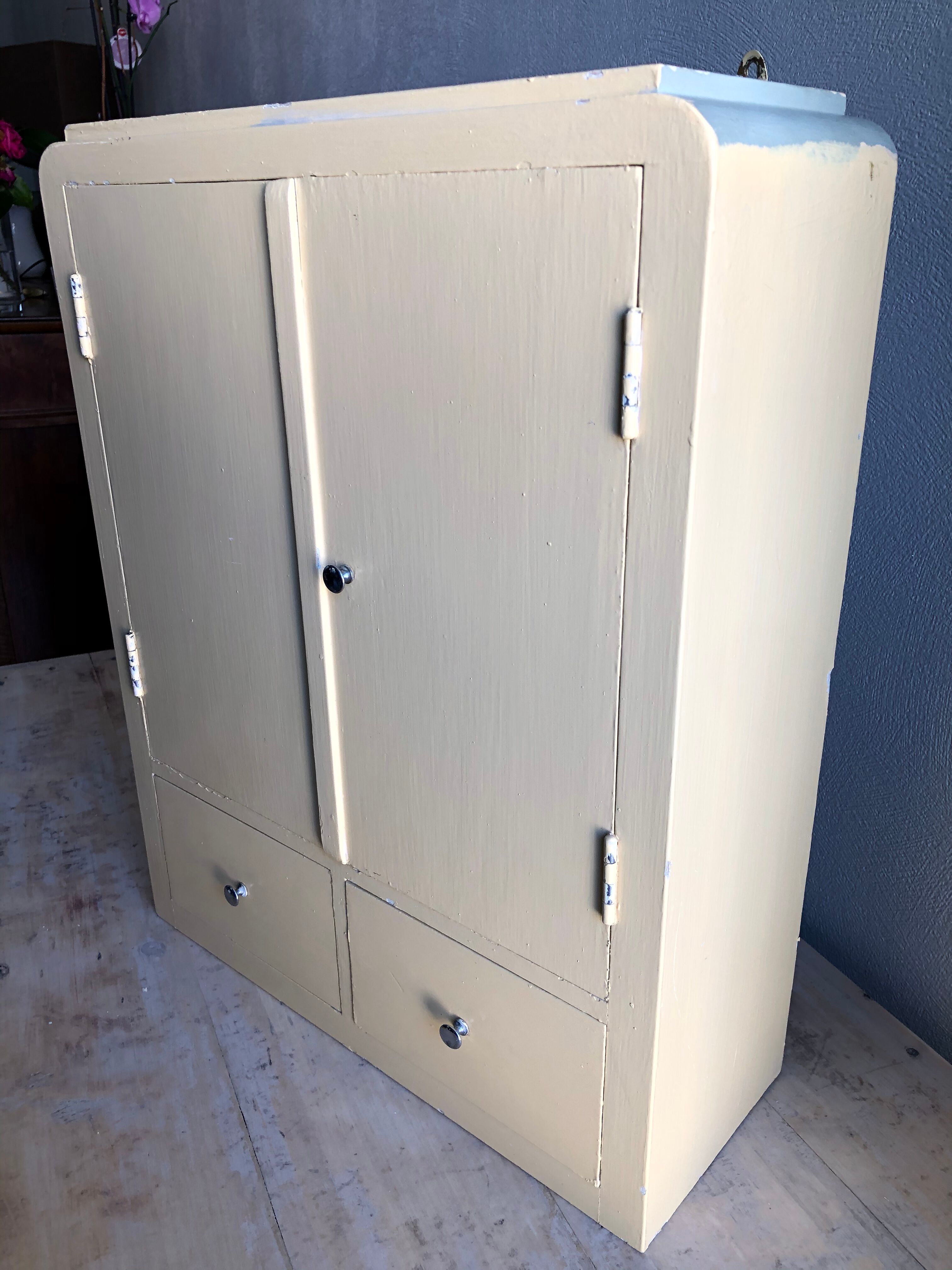 Weathered toilet cabinet