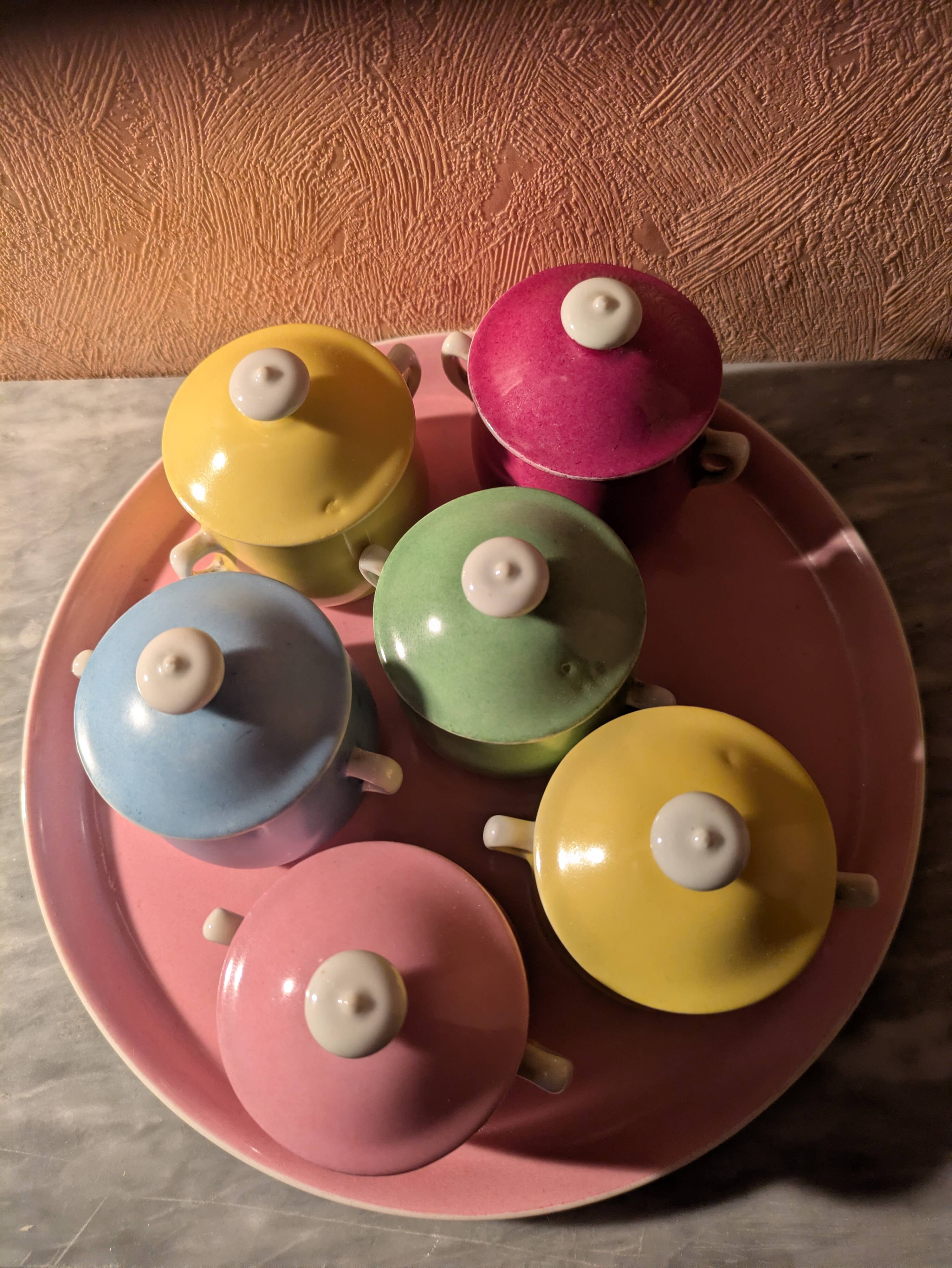 6 small porcelain cream pots from Limoges with a tray.