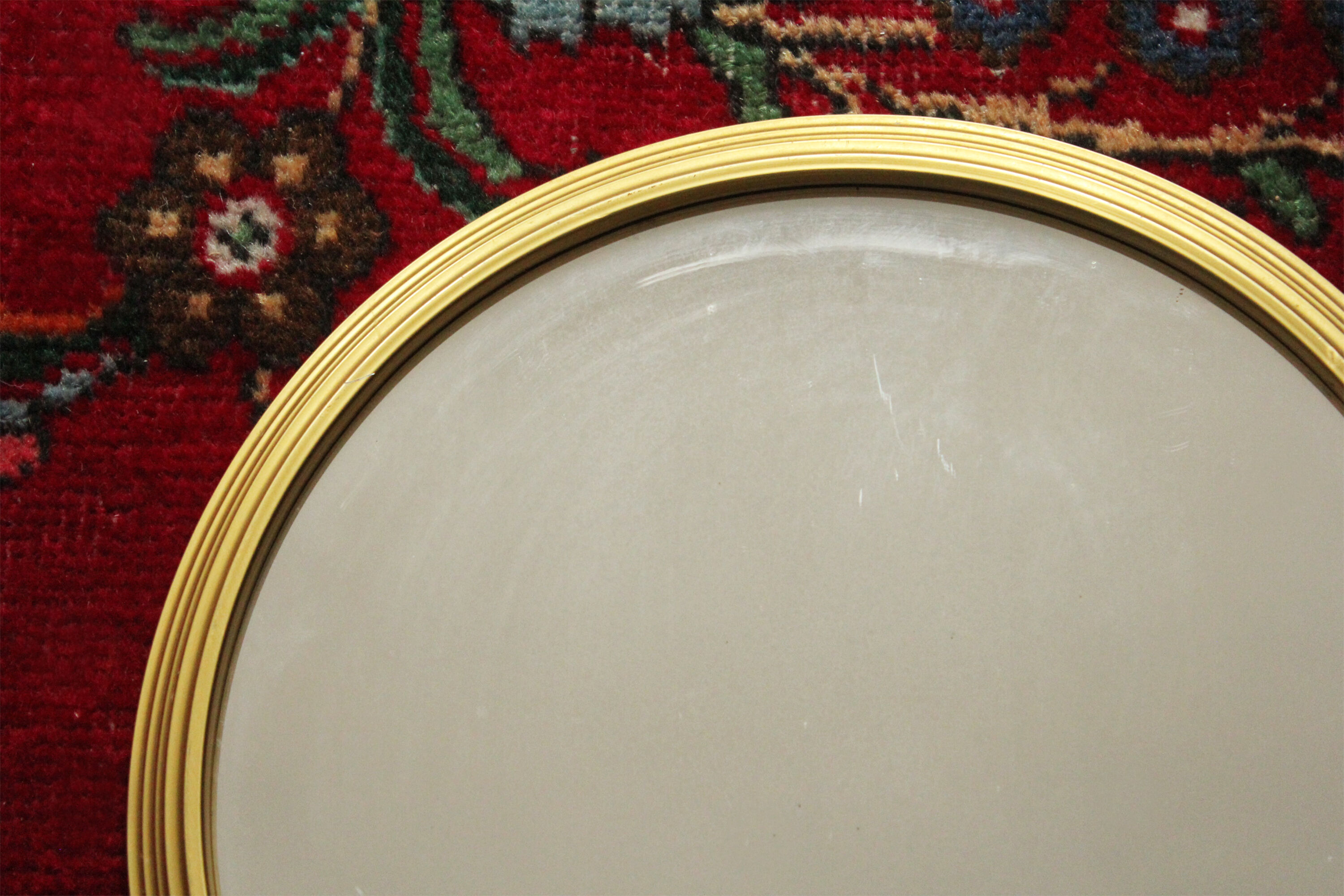 Miroir vintage rond  bordure acier doré