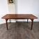 Teak dining table with extension by Johannes Andersen, for Uldum Møbelfabrik, Denmark, 1960.
