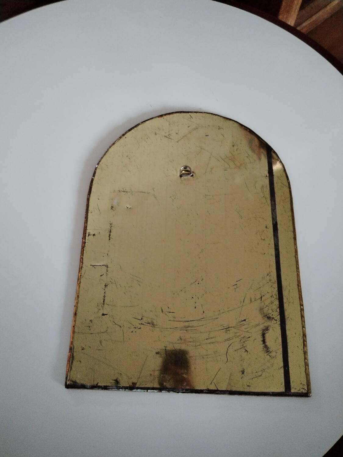 Old brass half moon mirror