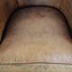 Club chair made of sheepskin leather finished with decorative nails