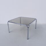 Coffee table with smoked glass top in chromed frame