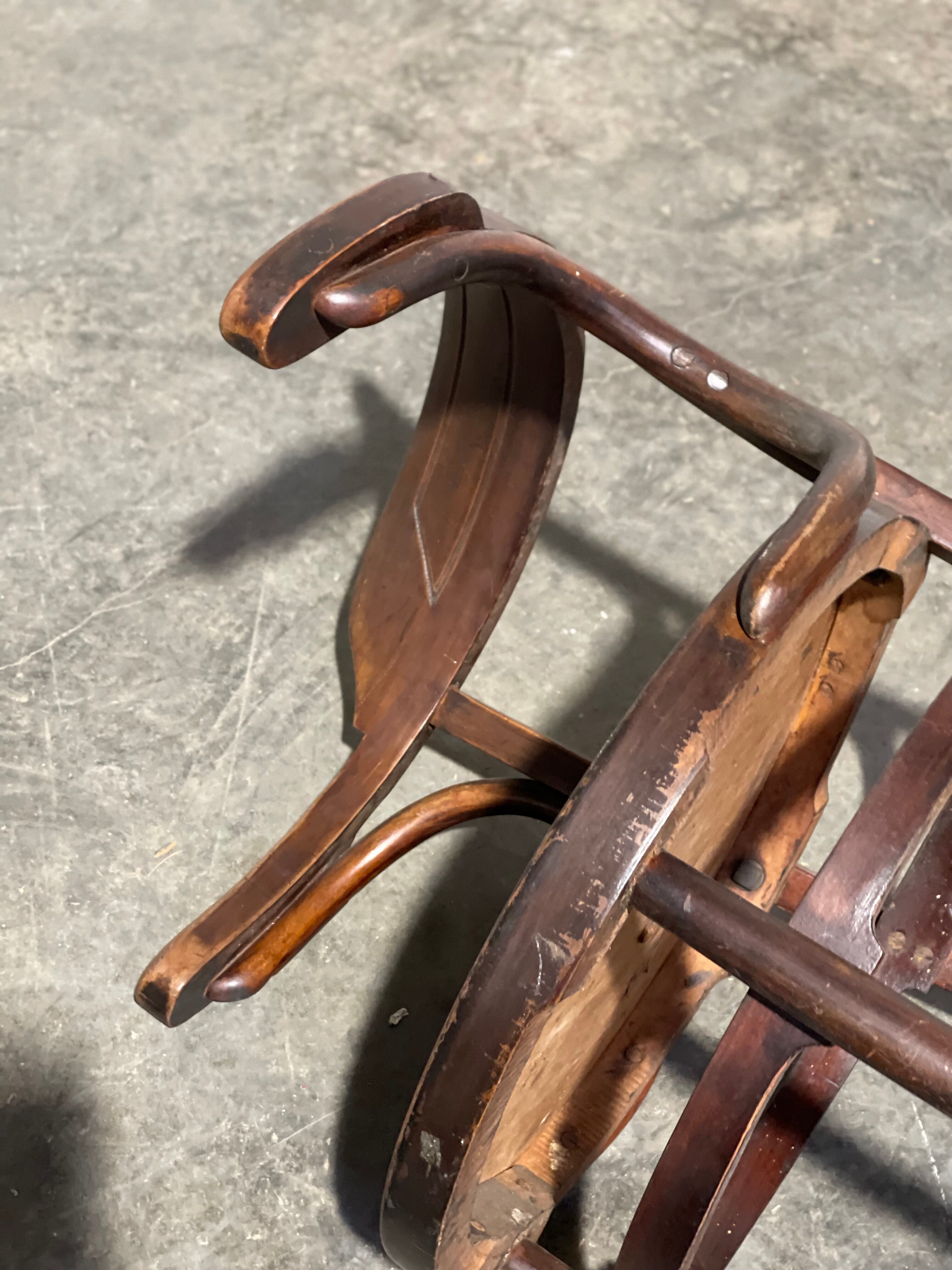 Curved wooden armchair