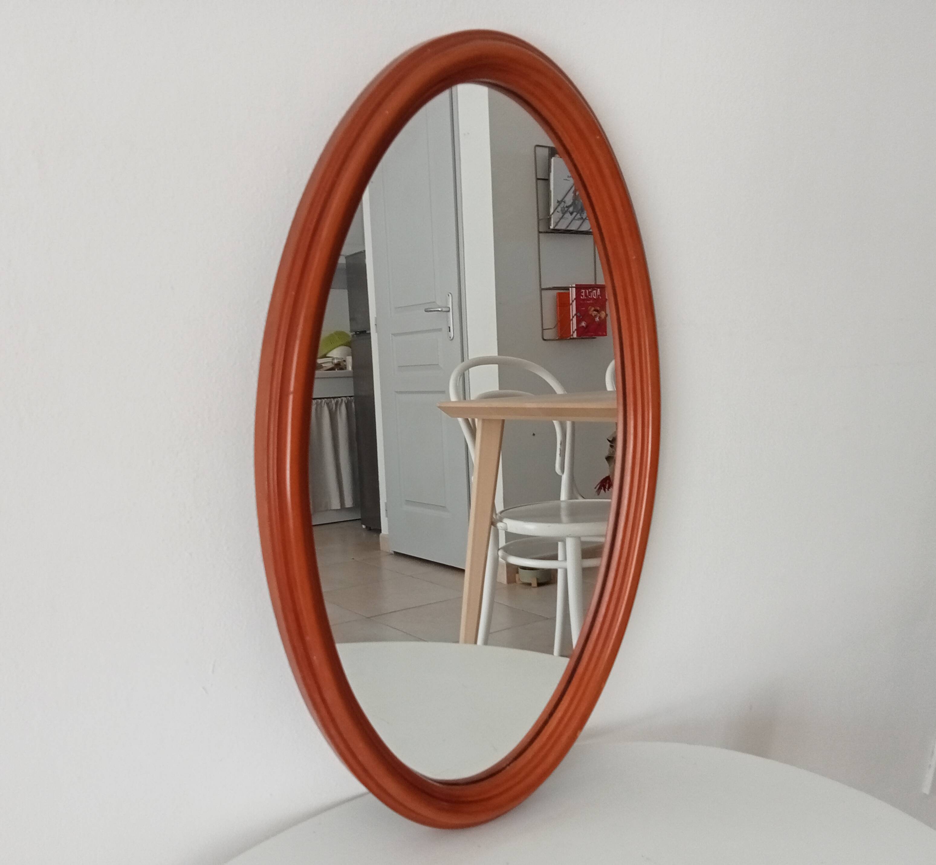 Vintage oval wooden mirror "caramel" from the 1960s.