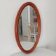 Vintage oval wooden mirror "caramel" from the 1960s.