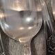 12 silver-plated dessert spoons with rocaille ribbon decoration, 18.5 cm