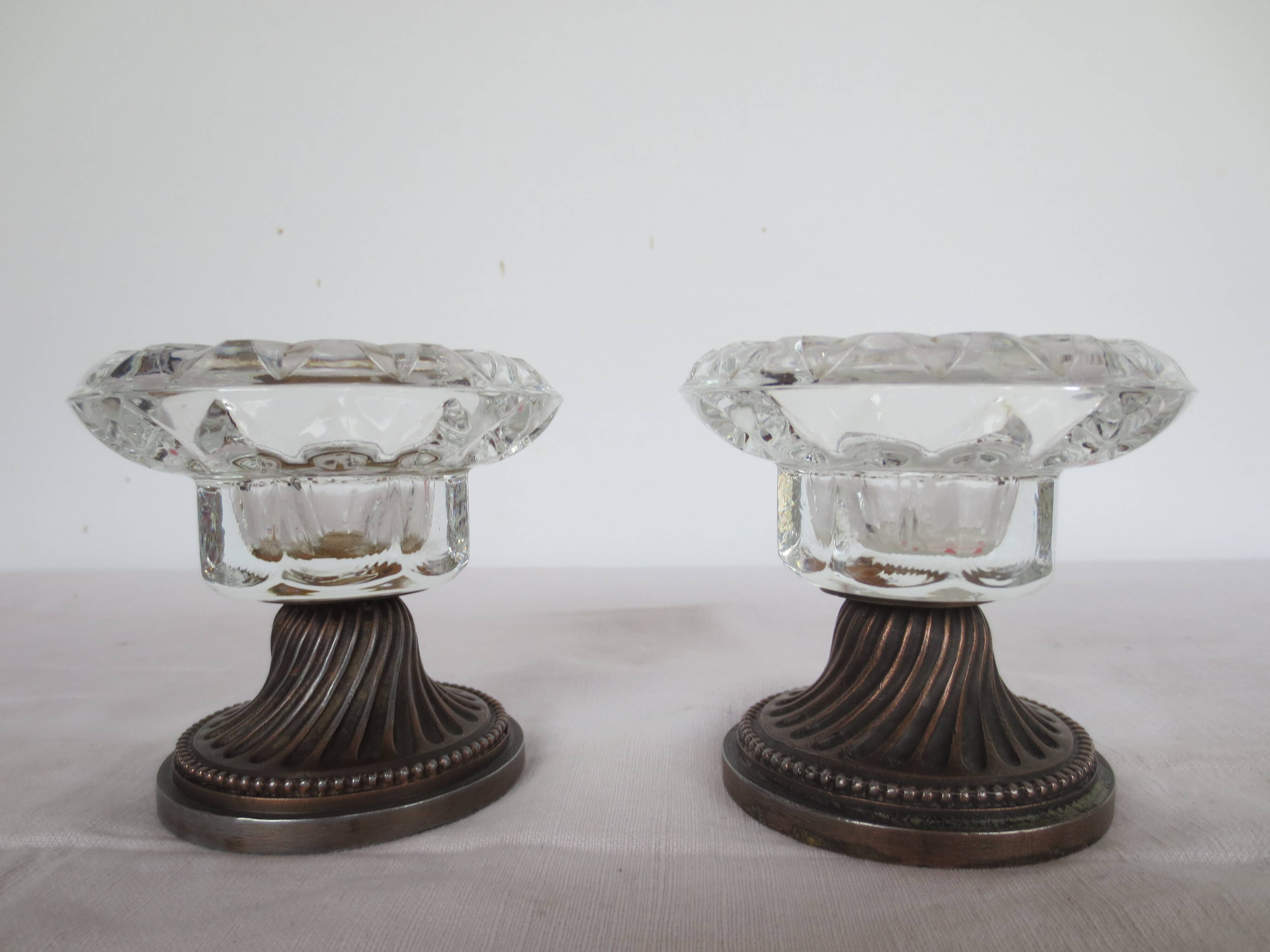 Two candle holders in bronze and crystal