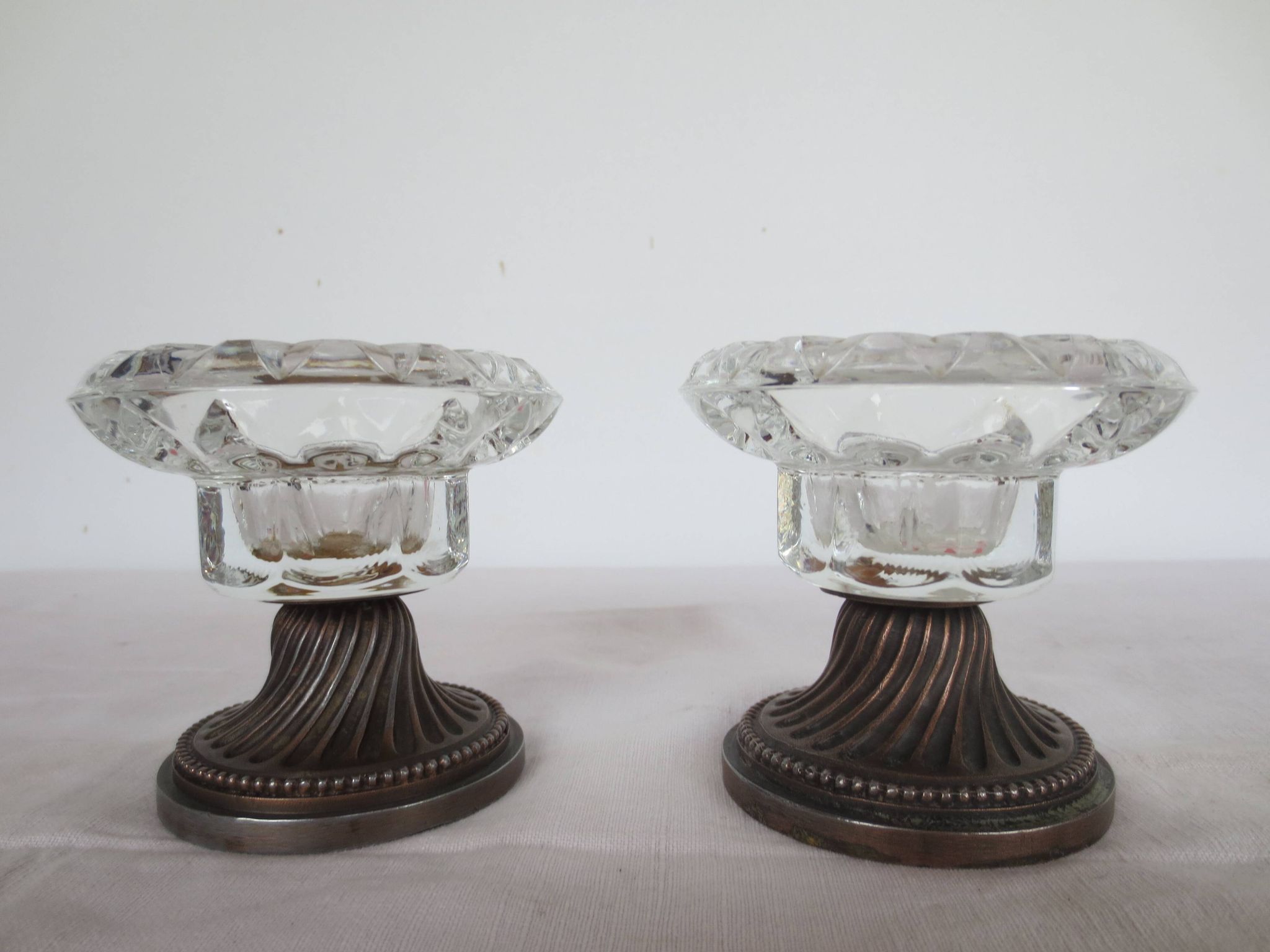 Two candle holders in bronze and crystal