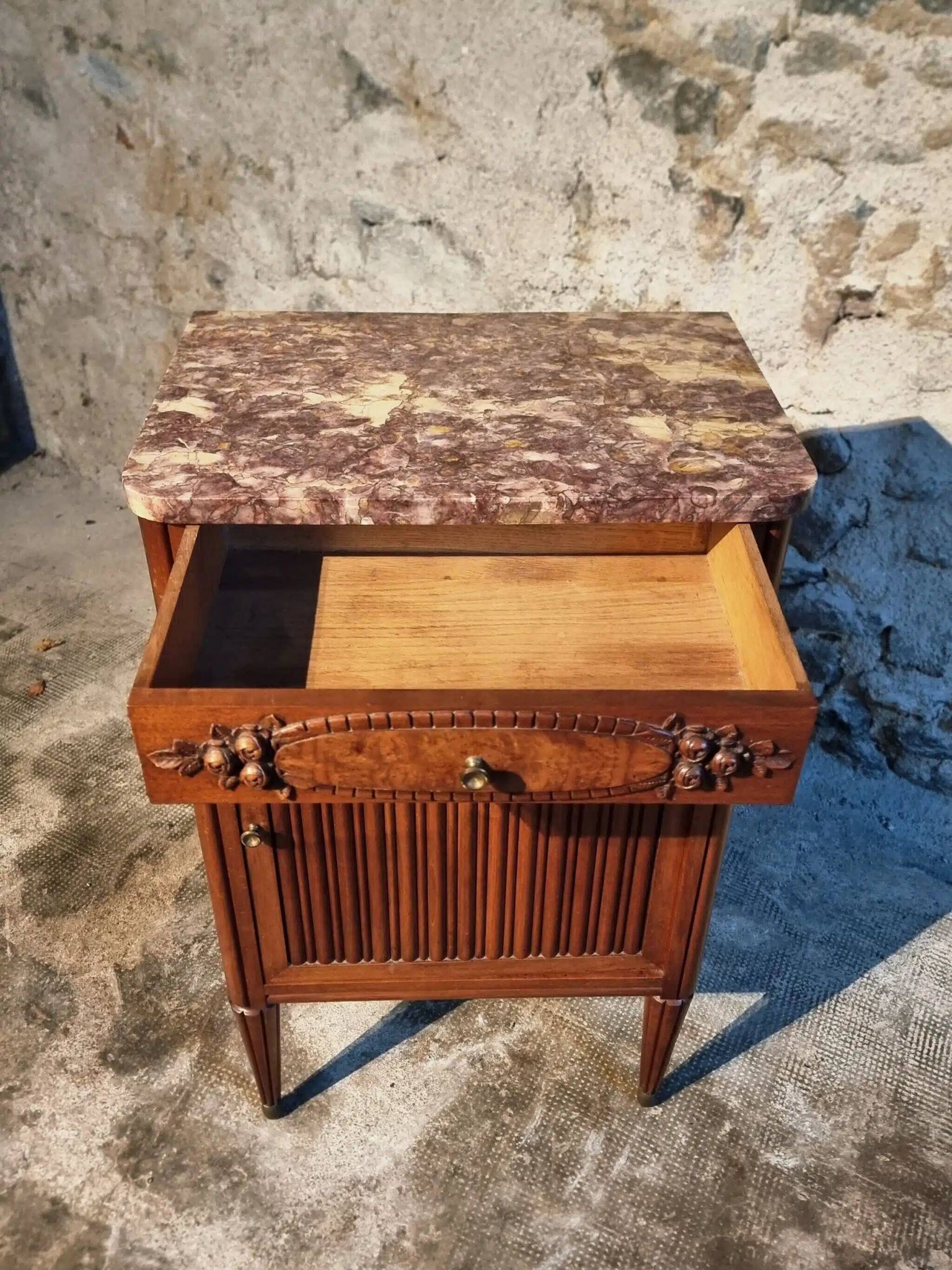 French antique bedside table in walnut with a marble top and porcelain interior, early 20th century.