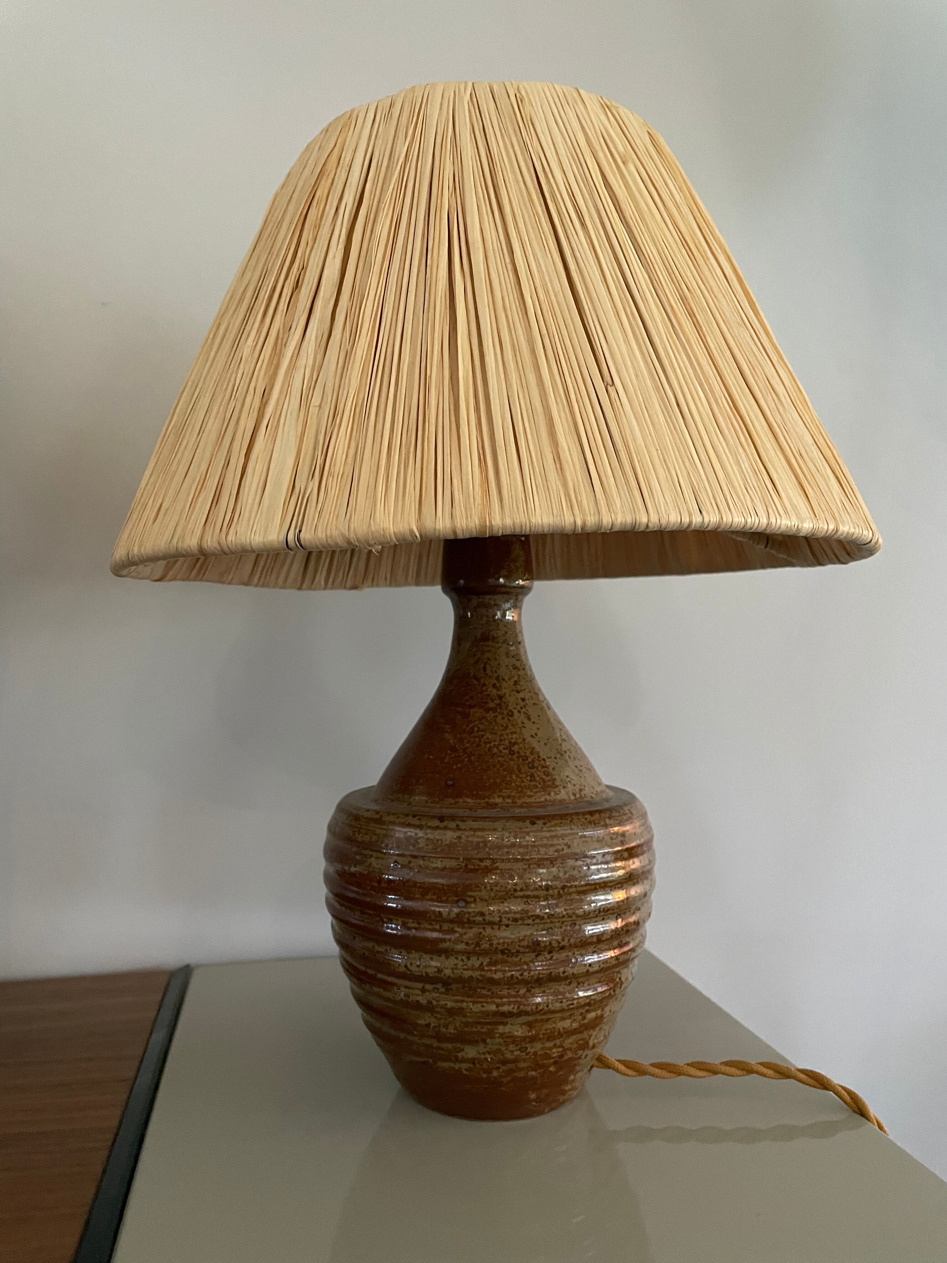 Sandstone lamp and raffia