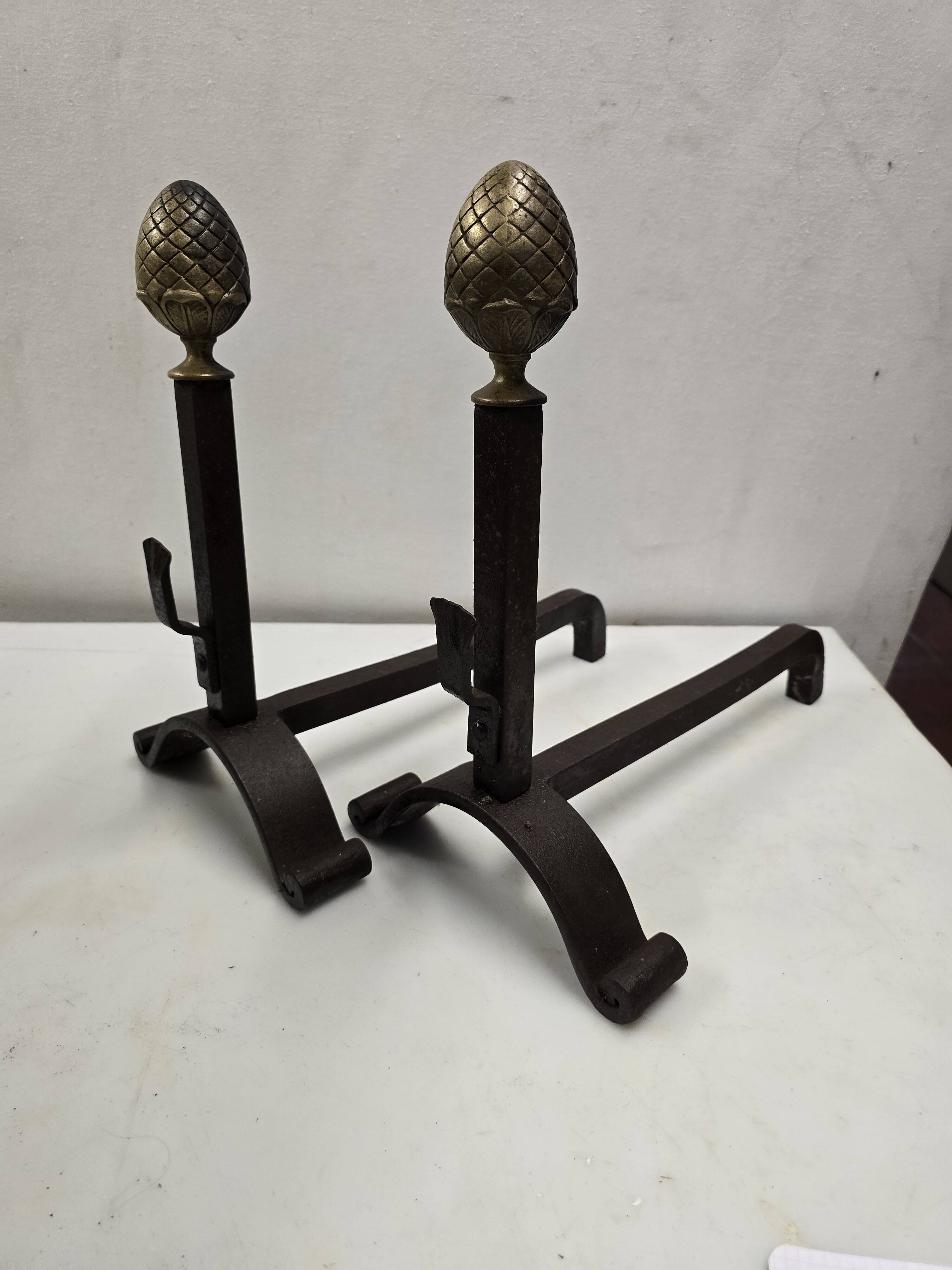 Old pair of wrought iron and bronze andirons