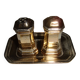 Silver-plated salt and pepper shakers presented on a small tray