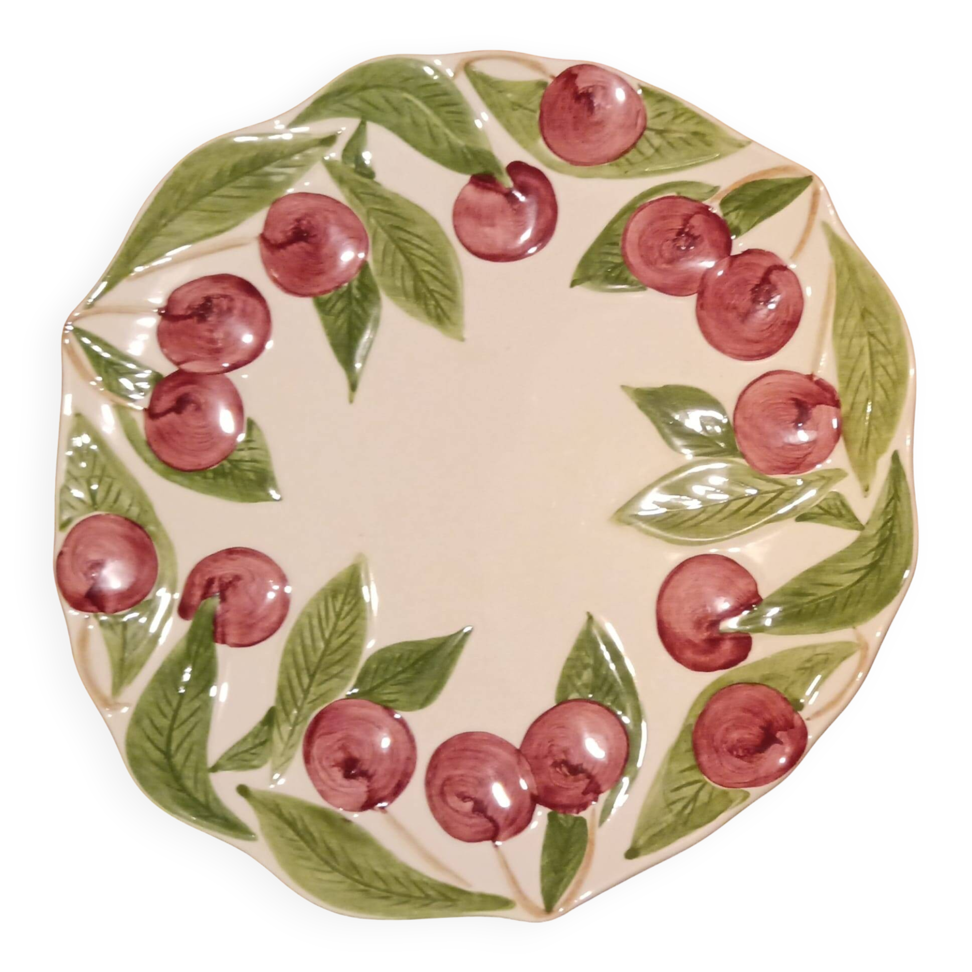 Longchamp barbotine plate with cherries from the early 20th century.