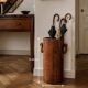 Art Deco umbrella stand in walnut with staves and ring handles, 1930.