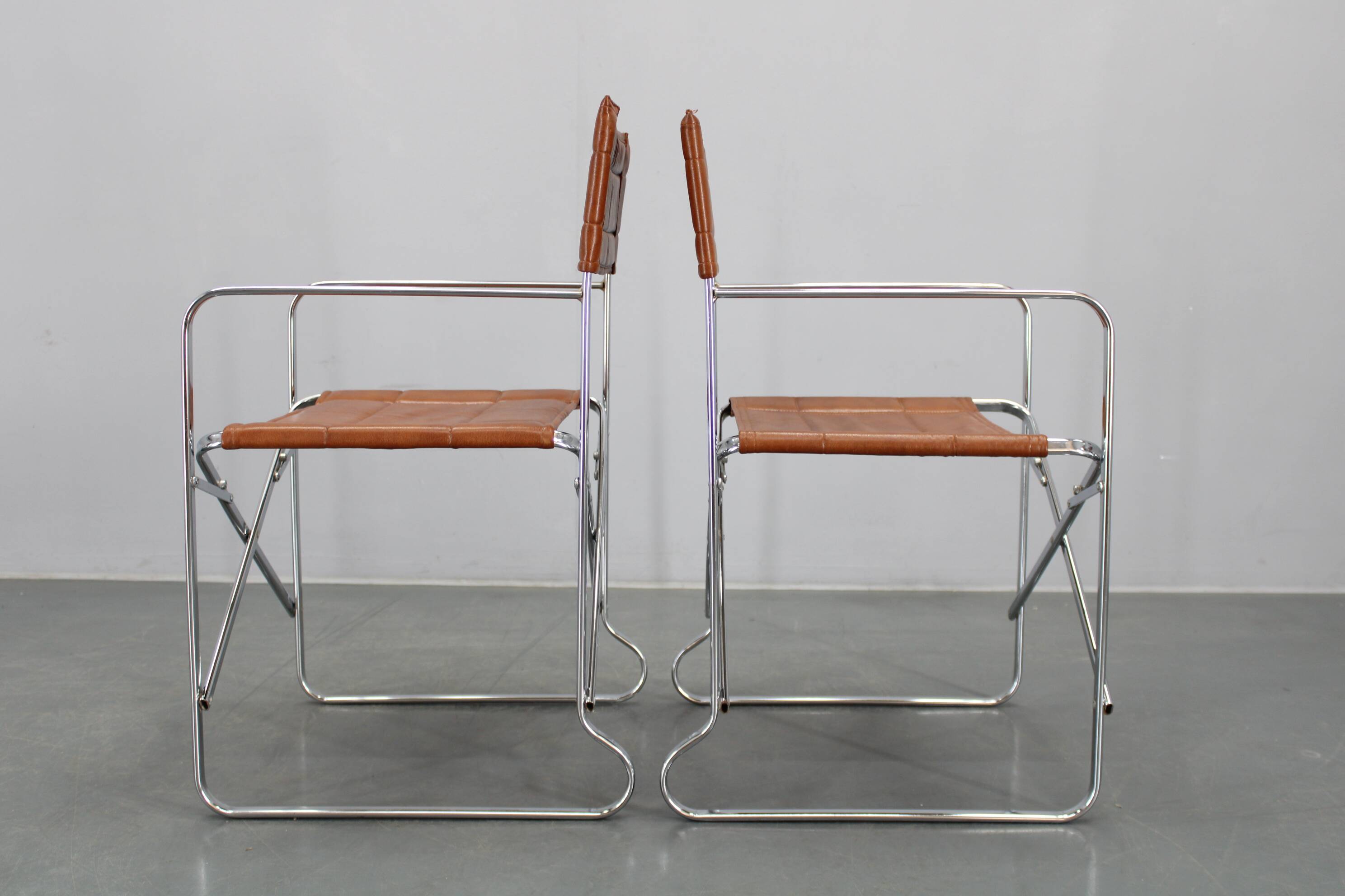 1970s pair of Italian folding chairs with leatherette upholstery