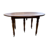 Round walnut table of 130 cm in diameter.