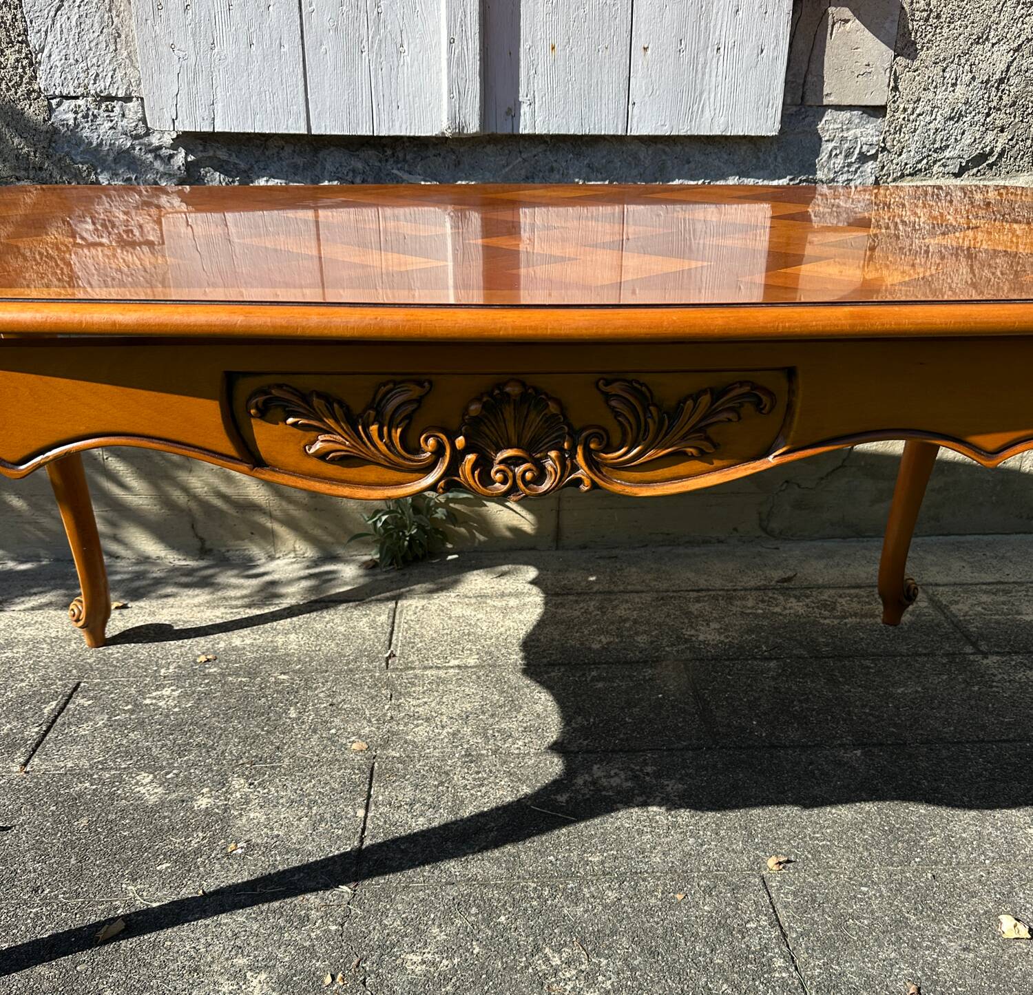 Antique extendable table in cherry wood and marquetry in the Louis XV style.