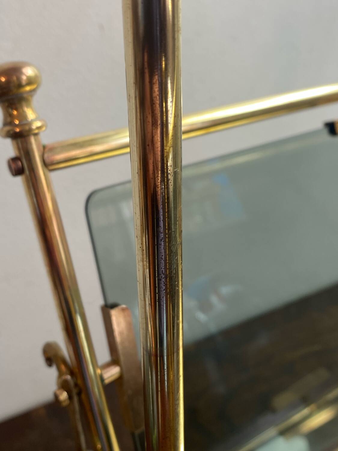 Brass magazine rack and blue-tinted glasses, 1950s.