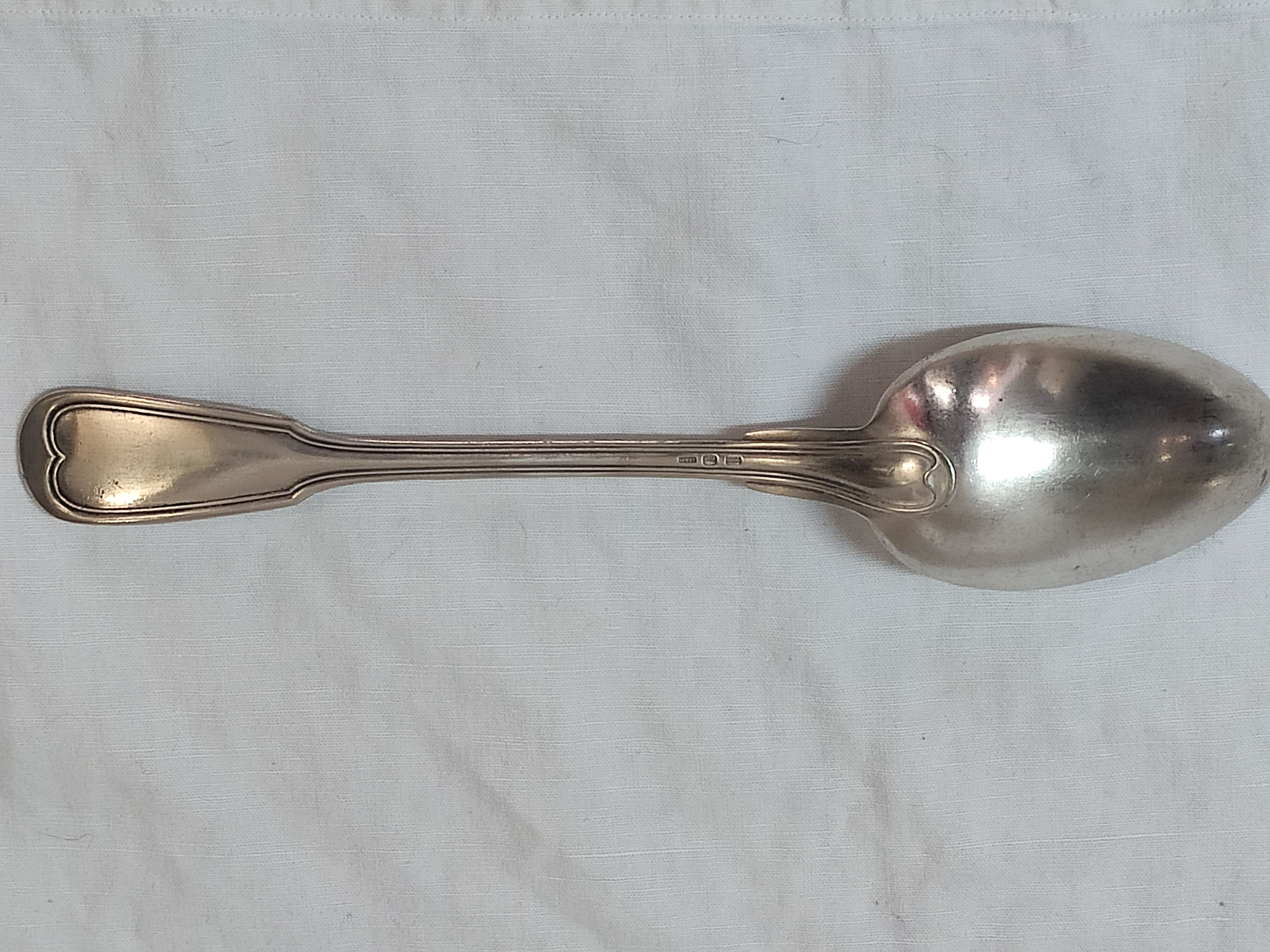 Serving spoon, silver metal.